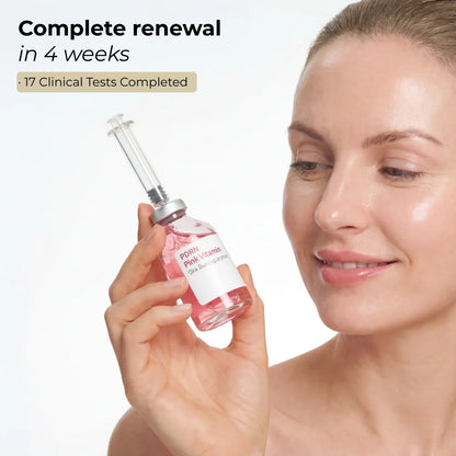 Woman holding Lumea PDRN Pink Vitamin ampoule for a 4-week skin renewal and glow routine